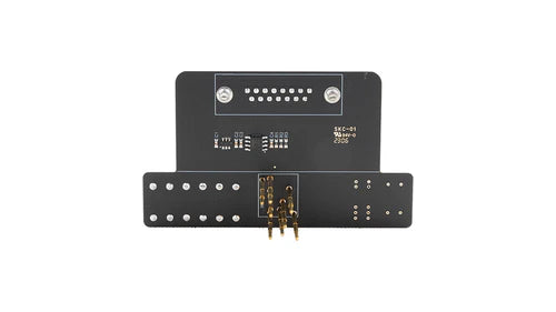 Black electronic module with labeled components on a white background
