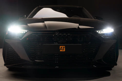 License plate cover on vehicle with lights on