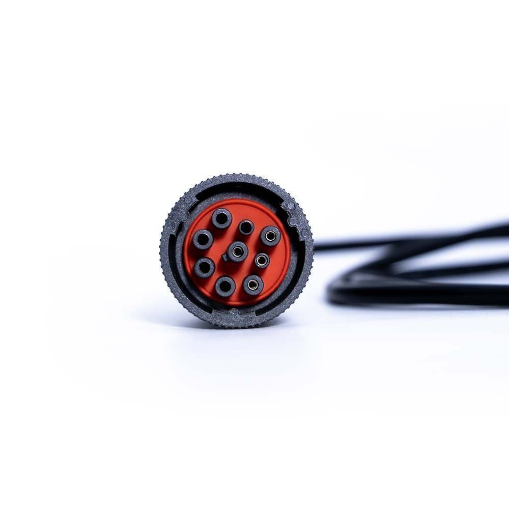 Close-up of a black and red connector on a white background