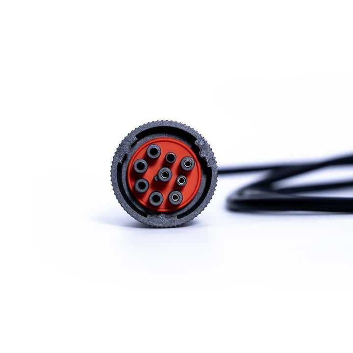 Close-up of a black and red connector on a white background