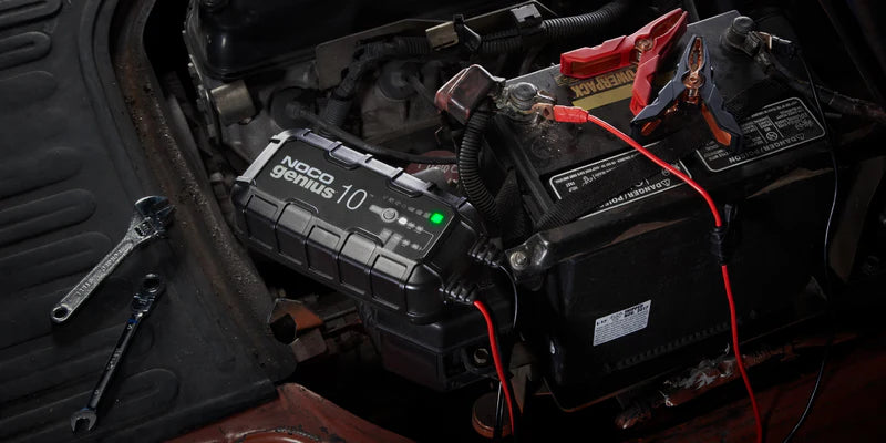 Genius 10 Amp Smart Charger in use for efficient charging of car and marine batteries
